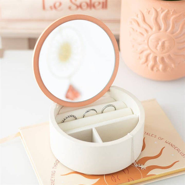 Jewelry storage box with sun motif