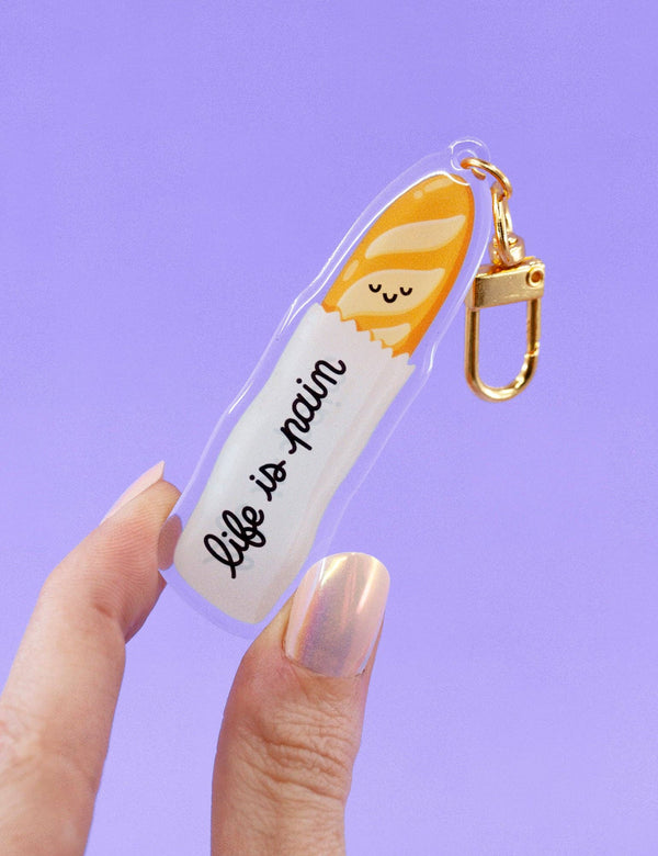 Porte-clés en – acrylique « Life is Pain » Baguette | Joanna Behar – vue 1
