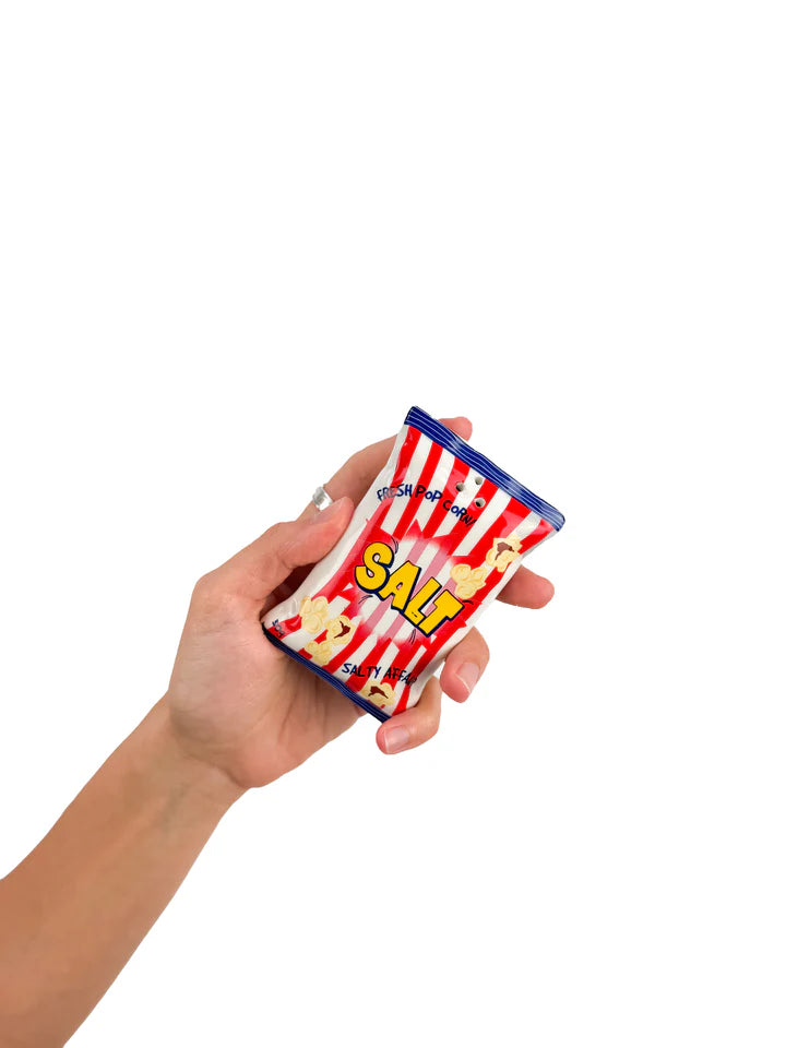 Salt and pepper shakers shaped like popcorn and chip bags