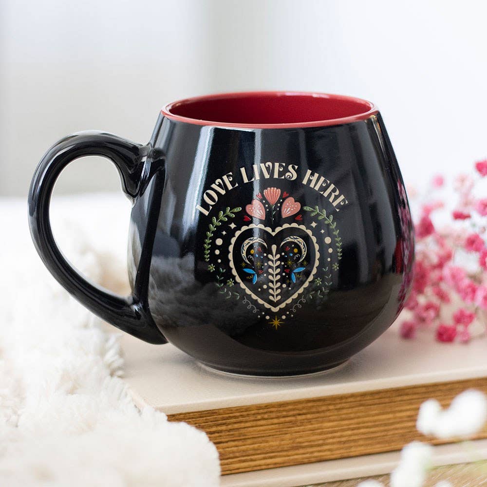 Tazza a forma di cuore "L'amore vive qui"