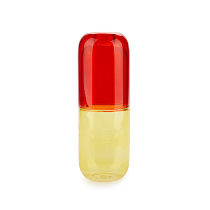 Bouteille de pilules d'eau et verre à boire