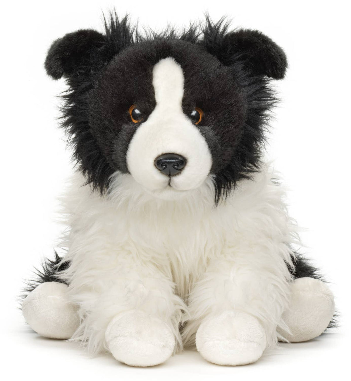 Plush border collie sitting without a leash