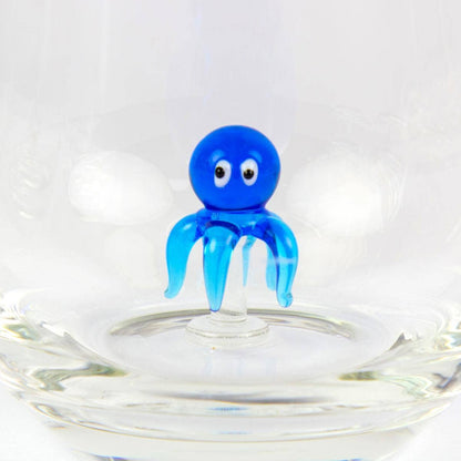 Drinking glass with a small octopus