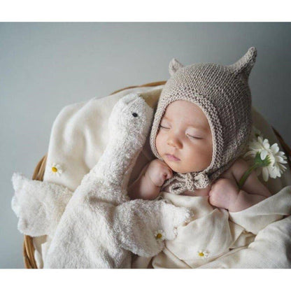 Small hot water bottle in the shape of a cuddly white goose
