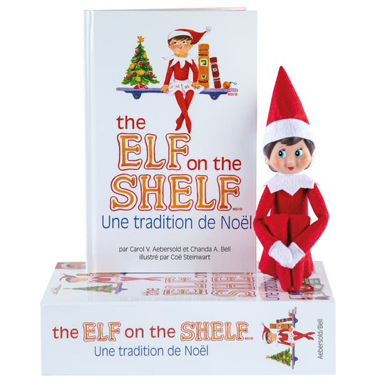 The Elf on the Shelf Cadeau set: FILLE – Français, 27x18,5 cm, set de cadeau avec poupée lutin scout et histoire à raconter + certificat d’adoption, en boîte carton, 0+