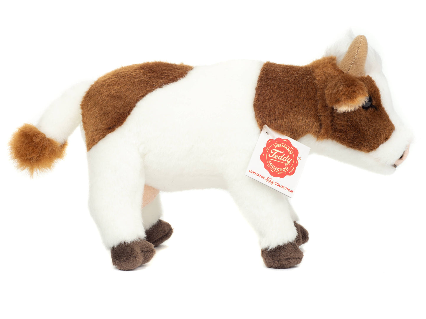 Brown and white cow plush toy