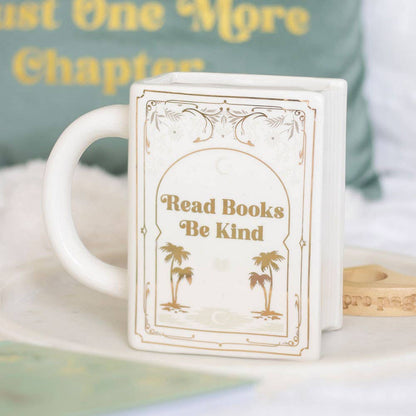 Read books, be kind. White book-shaped mug