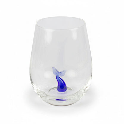 Drinking glass with a small glass whale tail