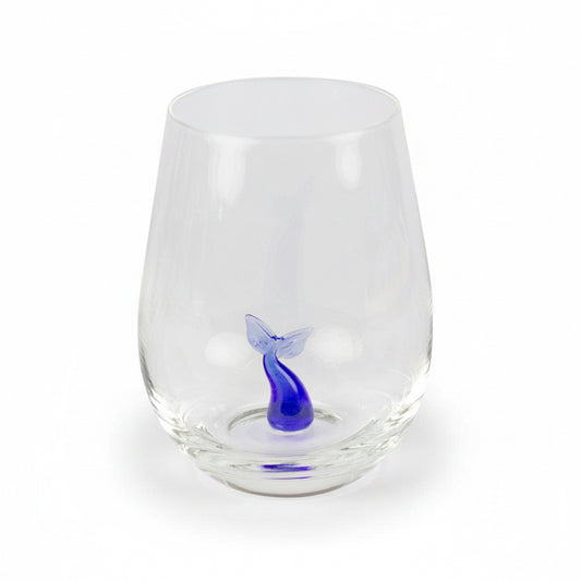 Drinking glass with a small glass whale tail