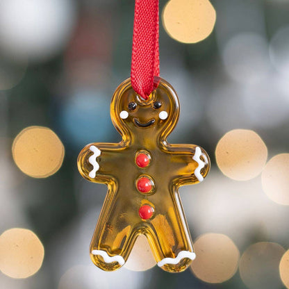 Hanging glass decorations in the shape of gingerbread men