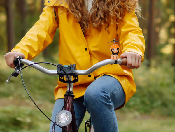 Kitten with helmet and propeller for handlebars