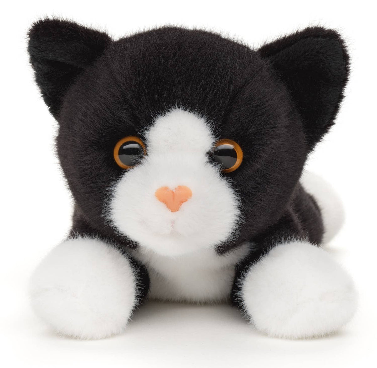 Black and white cat plush, lying down