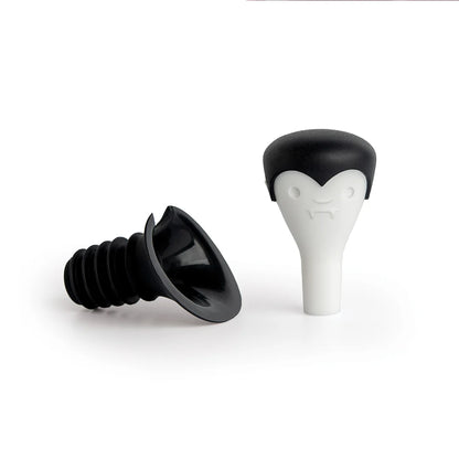 Count Corkula bottle stoppers have vampire fangs and black caps, perfect for wine enthusiasts.