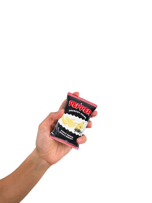 Salt and pepper shakers shaped like popcorn and chip bags