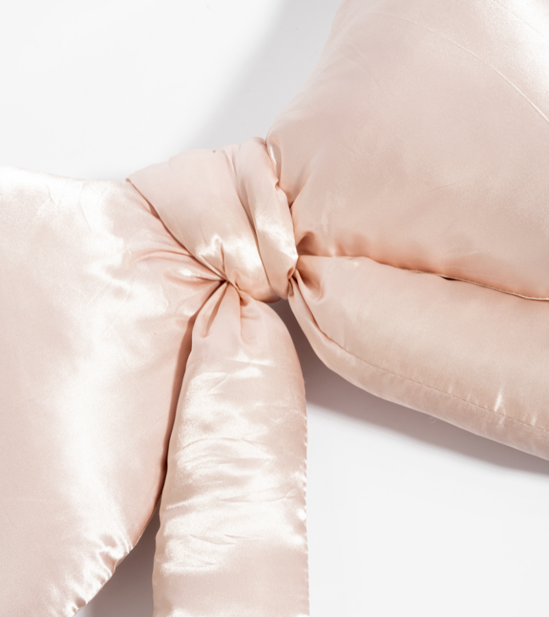 Satin knot cushion