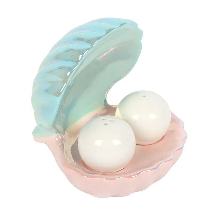 Salt and pepper egg cups in the shape of an iridescent coastal clam shell