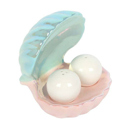 Salt and pepper egg cups in the shape of an iridescent coastal clam shell