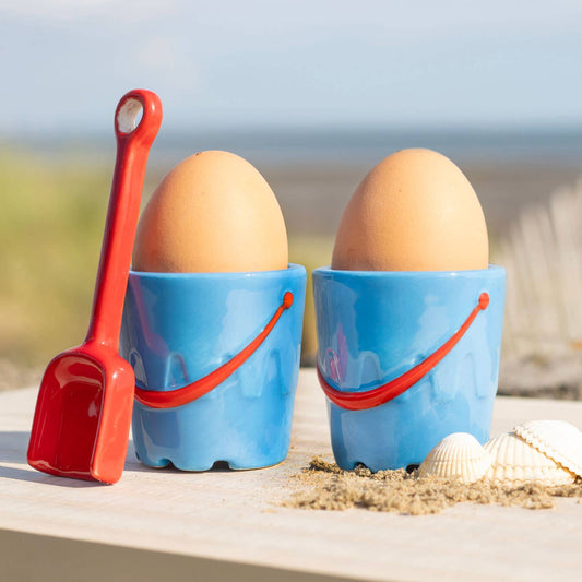 Set of 2 ceramic egg cups in the shape of buckets with spade-shaped spoons