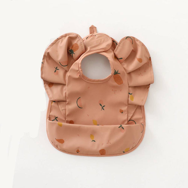 Pink ruffled waterproof bib with fruit print
