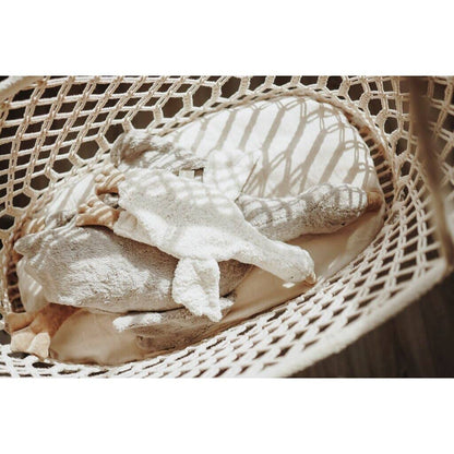 Small hot water bottle in the shape of a cuddly white goose